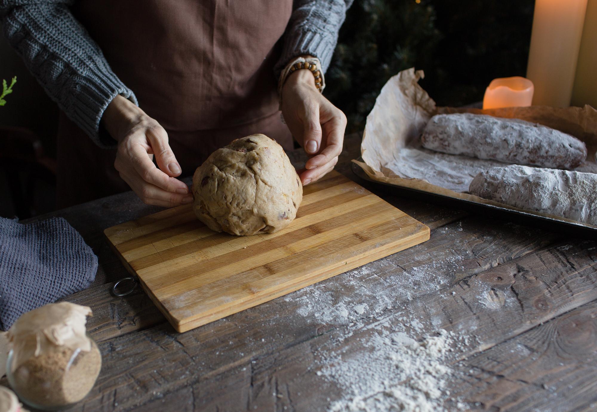 Close-up of hands kneading dough